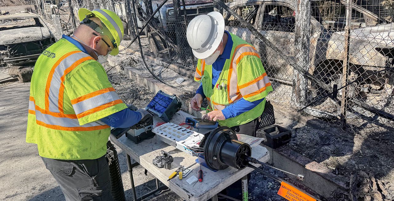 Spectrum technician working to restore service following wildfires in Southern California