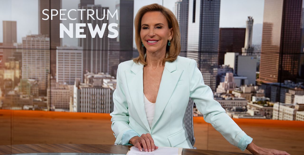 Spectrum News anchor Giselle Fernandez sitting at the anchor desk in the studio 